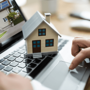 model of a house sitting on a laptop