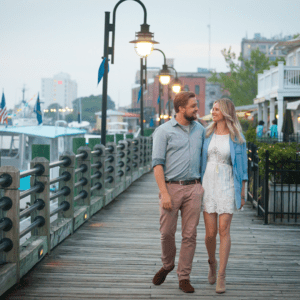 couple walking on a boardwalk
