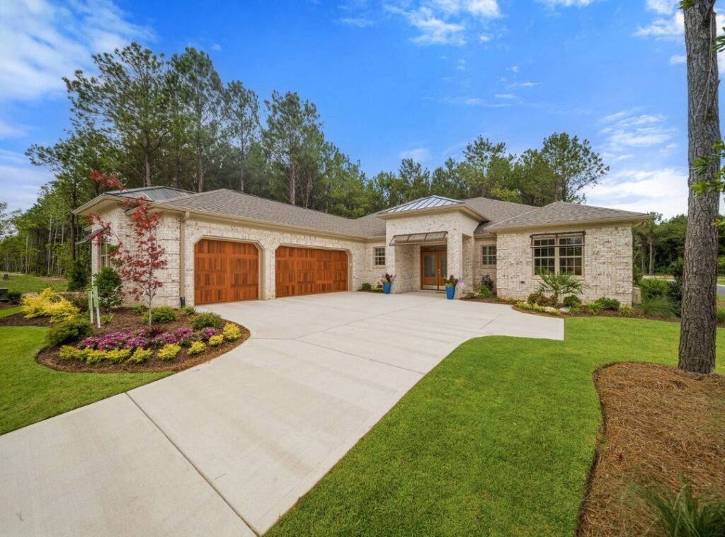 exterior view of a 2-car garage brick home